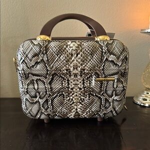 The Jet Setter Elegant Snakeskin Pattern travel cosmetic clutch